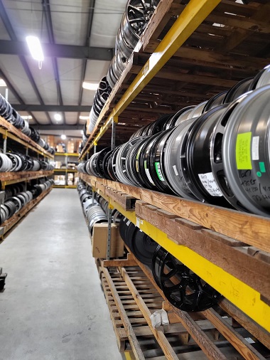 Racks of factory wheels for purchase in Marietta, GA at Metro Wheels & Accessories